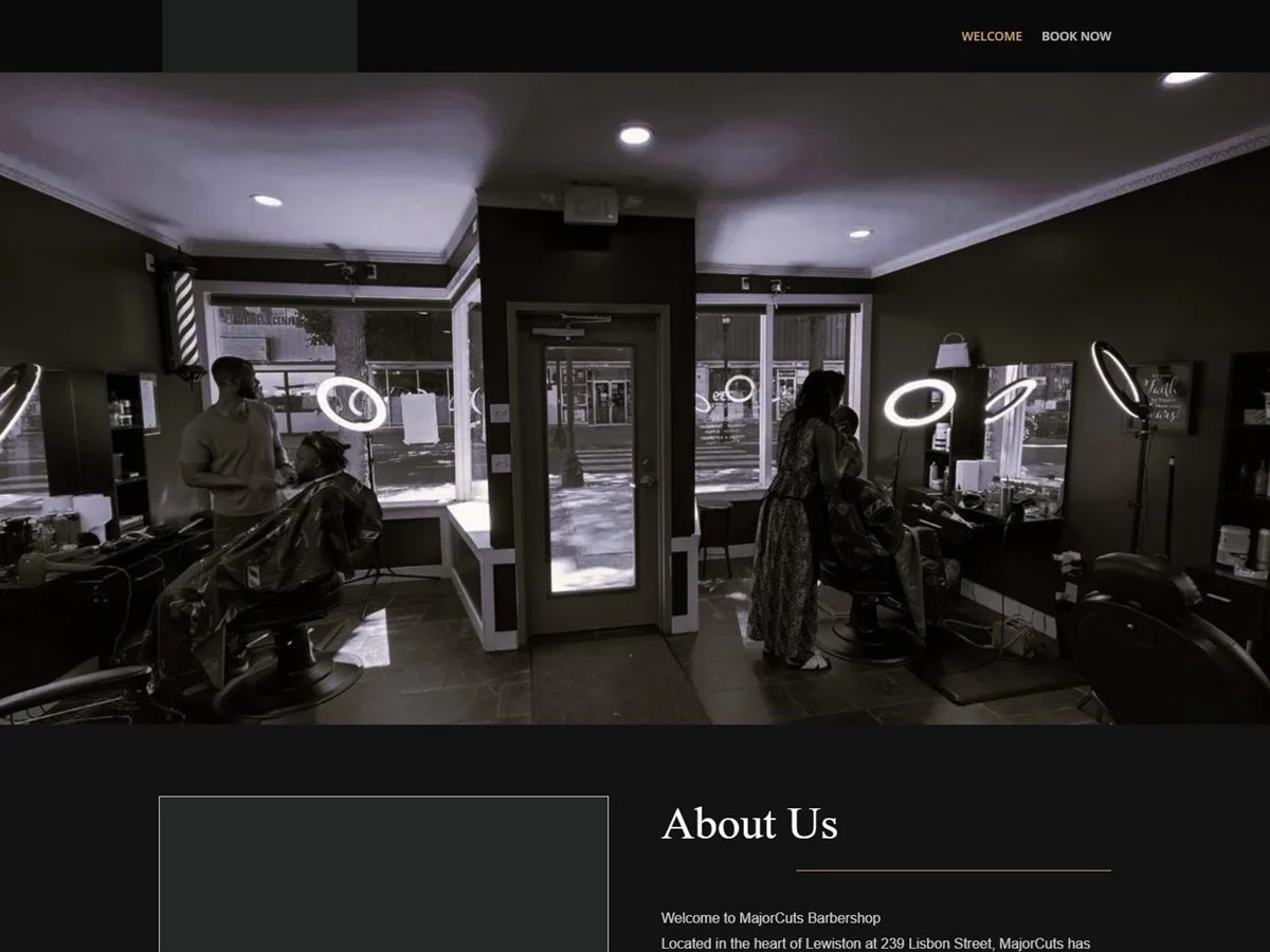 Major Cuts Barber Shop website homepage with a photo of the barbershop interior